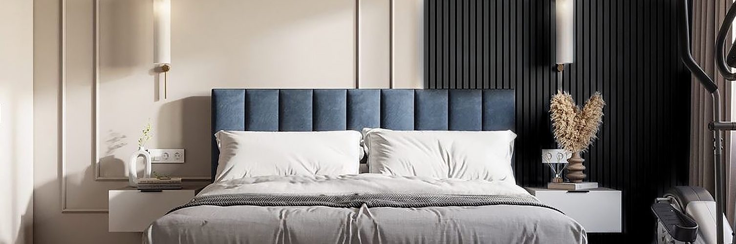 A serene bedroom featuring a blue headboard, white bed, and a striking black accent wall for a modern touch.