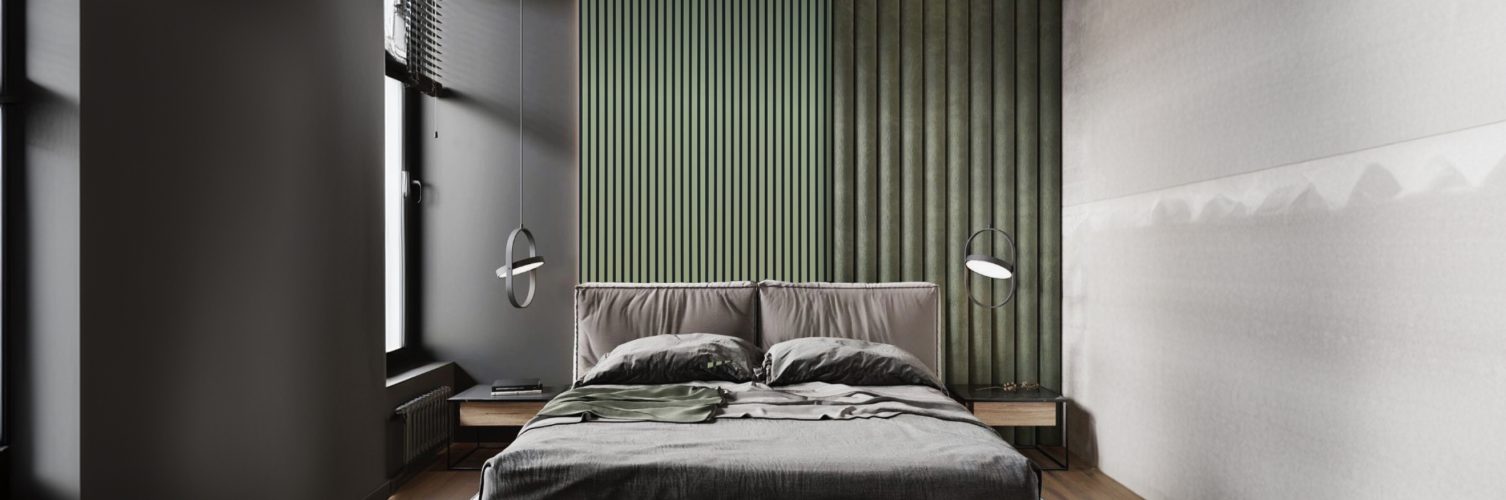 A cozy bedroom featuring a bed on a wooden floor, complemented by green walls and a stylish bedroom accent wall.