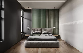 A cozy bedroom featuring a bed on a wooden floor, complemented by green walls and a stylish bedroom accent wall.