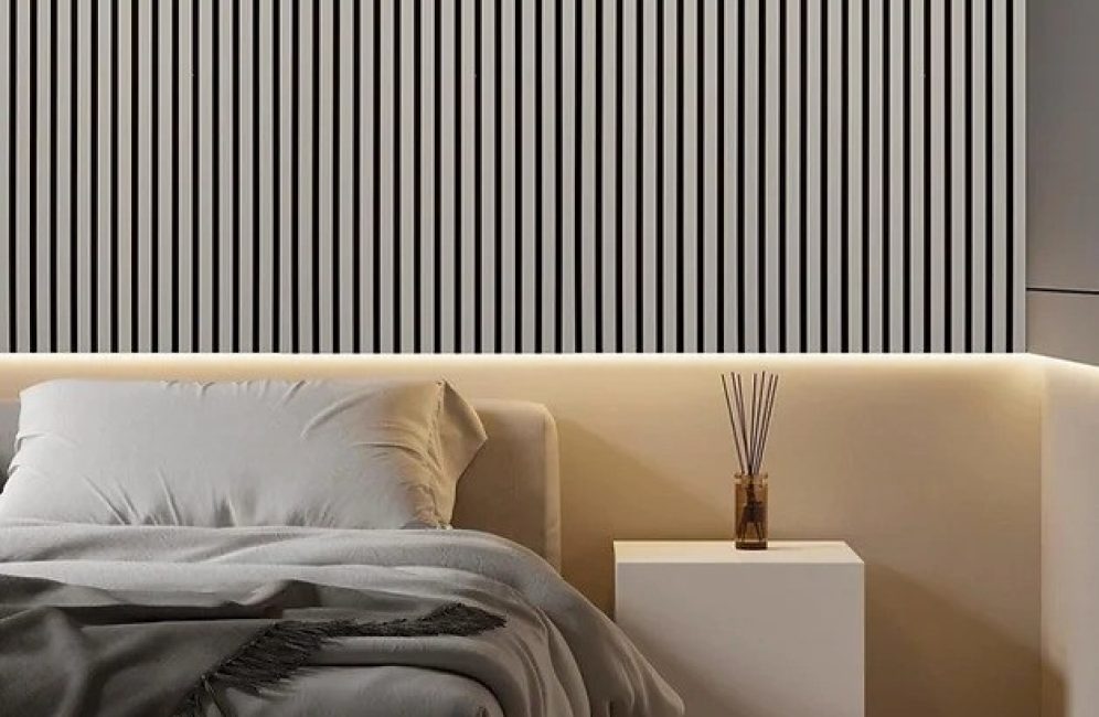 A chic bedroom with a distinctive black and white striped wall, enhancing the space as a unique accent wall in the bedroom.